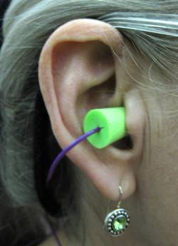 MOE member stylishly matches electric green earings and ear plug. Go MOE !!