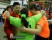 Team 2638 embraces student Ana in a group hug