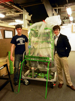 Steve and Ben pose with the packed robot